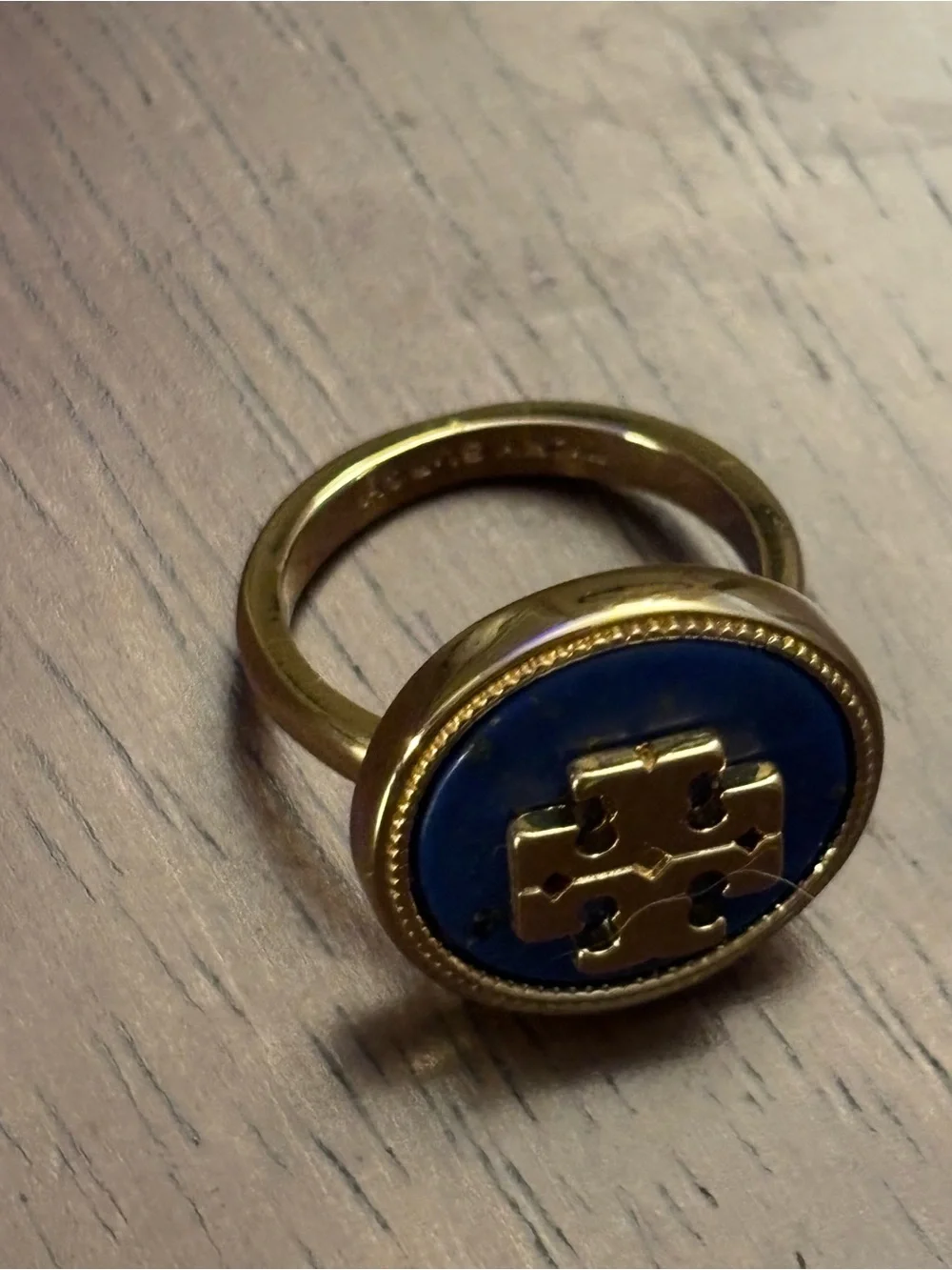 Tory Burch Gold-plated Ring with Deep Blue cover Logo.